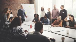 Adults at a conference table working together